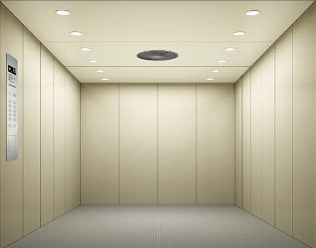 cargo lift featuring a wall-mounted light, suitable for moving heavy items.